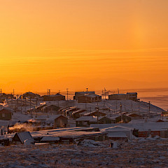 Arctic community at sunset